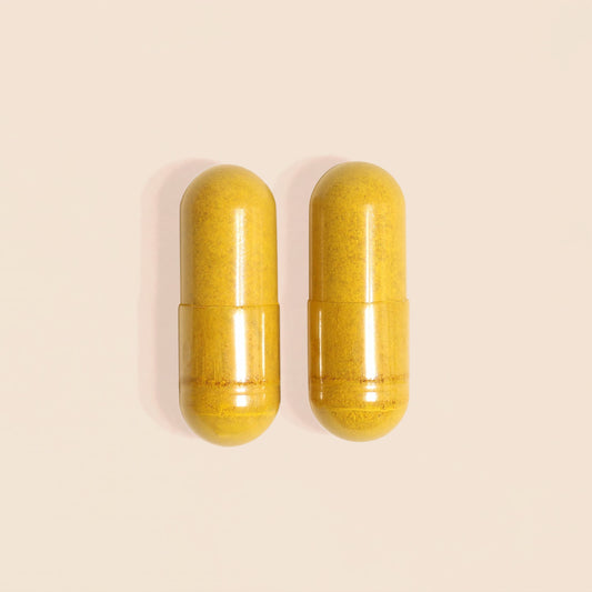Frondescent Berberine+ AMPK Activator capsules shown on marble surface, a clean botanical supplement designed to support metabolic balance and hormone health.