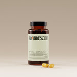 Frondescent berberine+ supplement bottle with capsules on a beige background