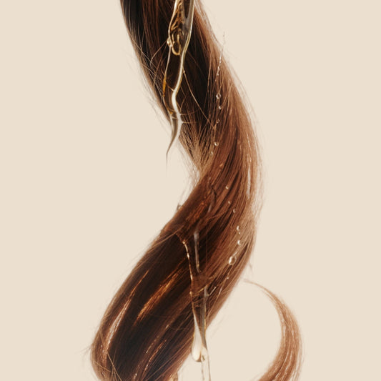 strand of hair with hair oil 