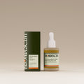 Frondescent skincare product with dropper bottle and box on a beige background