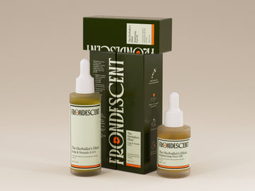 Frondescent's hair and face oils on a beige background