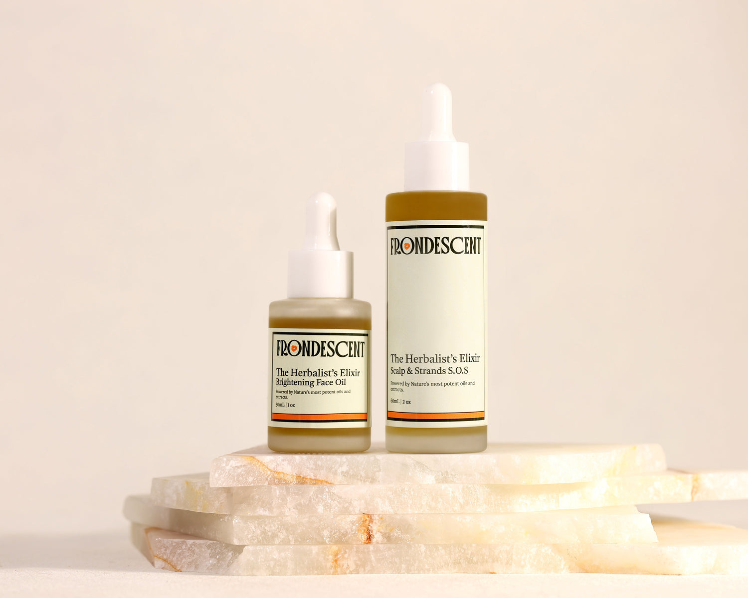 Frondescent's hair and face oils on a light background