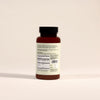 Back of Frondescent Berberine+AMPK Activator bottle on a beige background. Helps regulate hormones, blood sugar, and help with insulin resistance.
