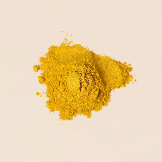 Frondescent Berberine+AMPK Activator powder on a beige background. Helps regulate hormones, blood sugar, and help with insulin resistance.